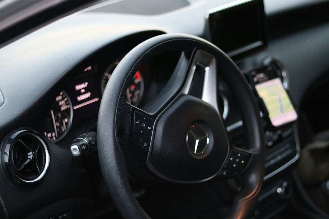 a steering wheel and dashboard of a car